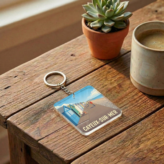 Porte-clés souvenir de la ville de Cayeux-sur-Mer avec une illustration stylisée.