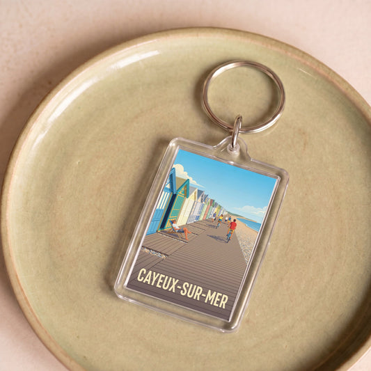 Porte-clés souvenir de la ville de Cayeux-sur-Mer avec une illustration stylisée.