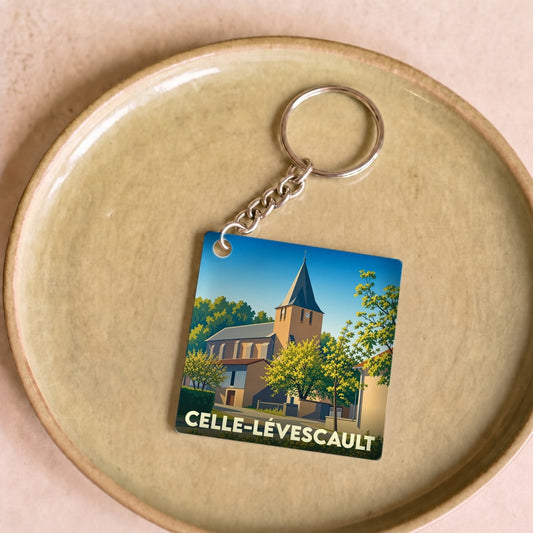 Porte-clés souvenir de la ville de Celle-Lévescault avec une illustration stylisée de son église.
