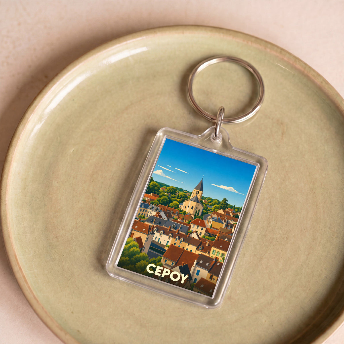 Porte-clés souvenir de la ville de Cepoy avec une illustration stylisée.