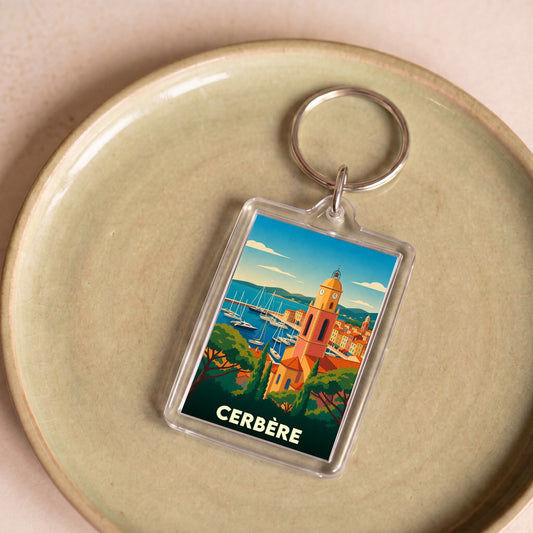 Porte-clés souvenir de la ville de Cerbère avec une illustration stylisée.