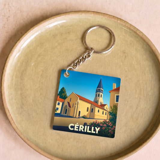 Porte-clés souvenir de la ville de Cérilly avec une illustration stylisée de son église.