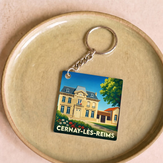 Porte-clés souvenir de la ville de Cernay-lès-Reims avec une illustration stylisée de sa mairie.