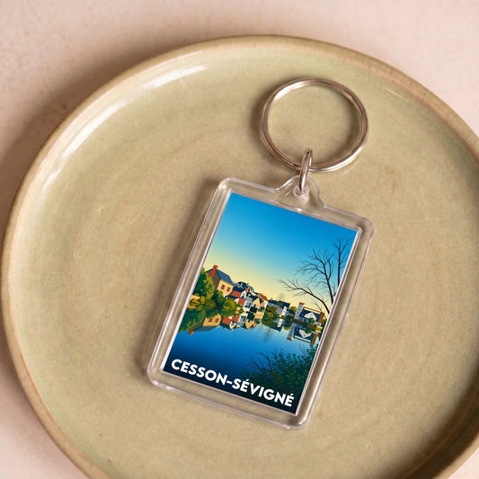 Porte-clés souvenir de la ville de Cesson-Sévigné avec une illustration stylisée.