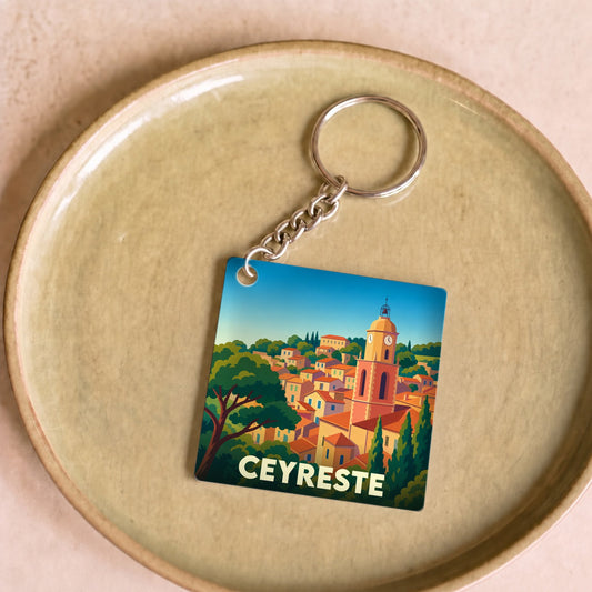 Porte-clés souvenir de la ville de Ceyreste avec une illustration stylisée.