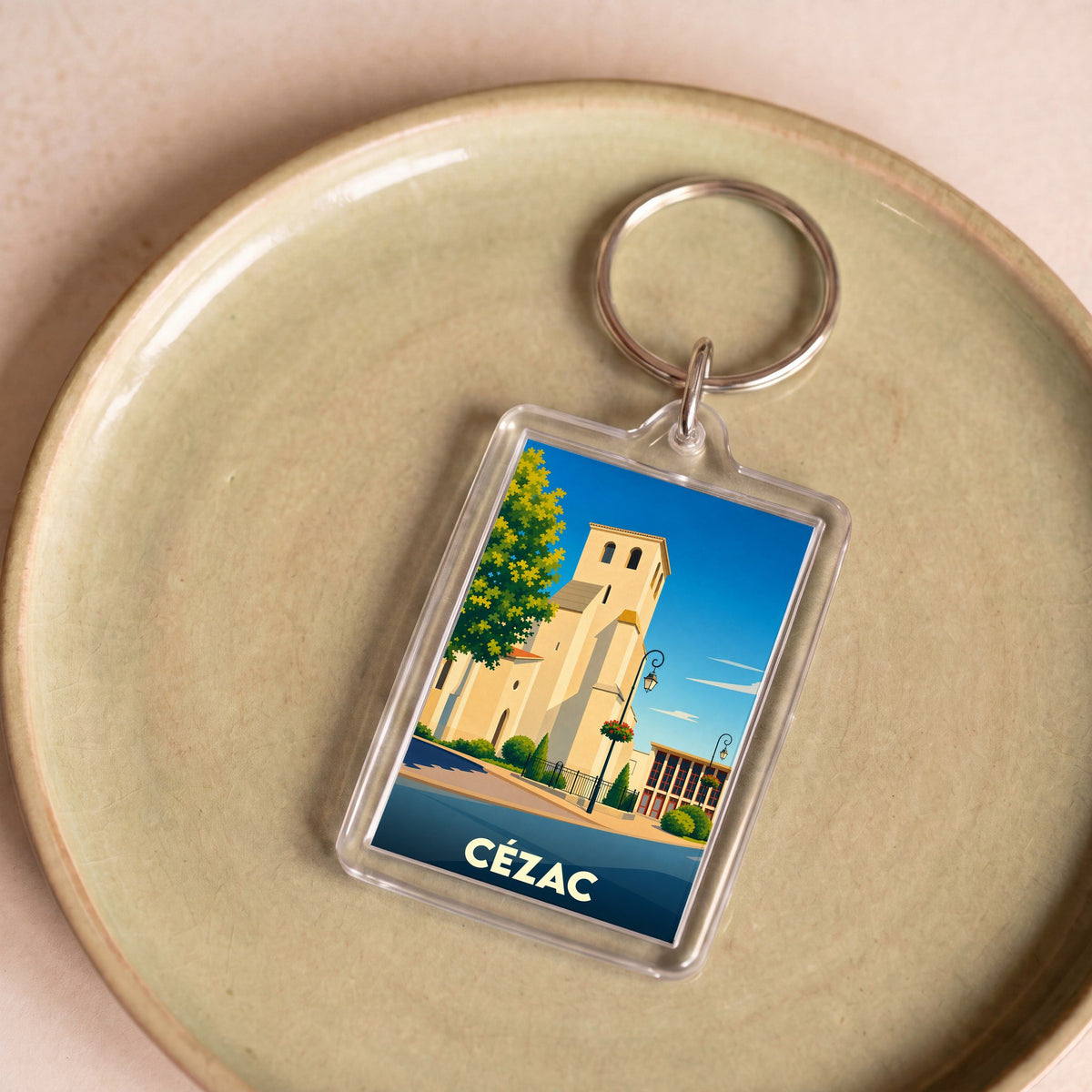 Porte-clés souvenir de la ville de Cézac avec une illustration stylisée.
