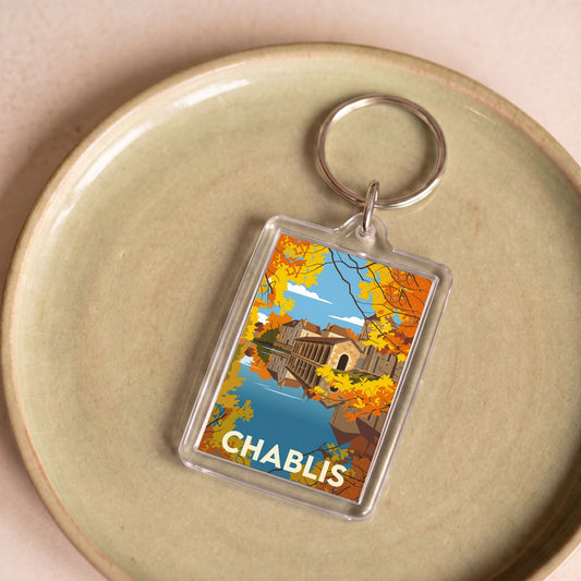 Porte-clés souvenir de la ville de Chablis avec une illustration stylisée.