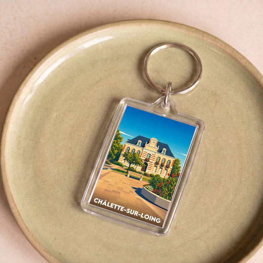 Porte-clés souvenir de la ville de Châlette-sur-Loing avec une illustration stylisée.