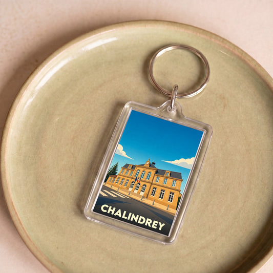 Porte-clés souvenir de la ville de Chalindrey avec une illustration stylisée.