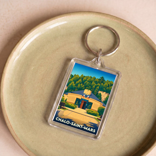 Porte-clés souvenir de la ville de Chalo-Saint-Mars avec une illustration stylisée de sa mairie.