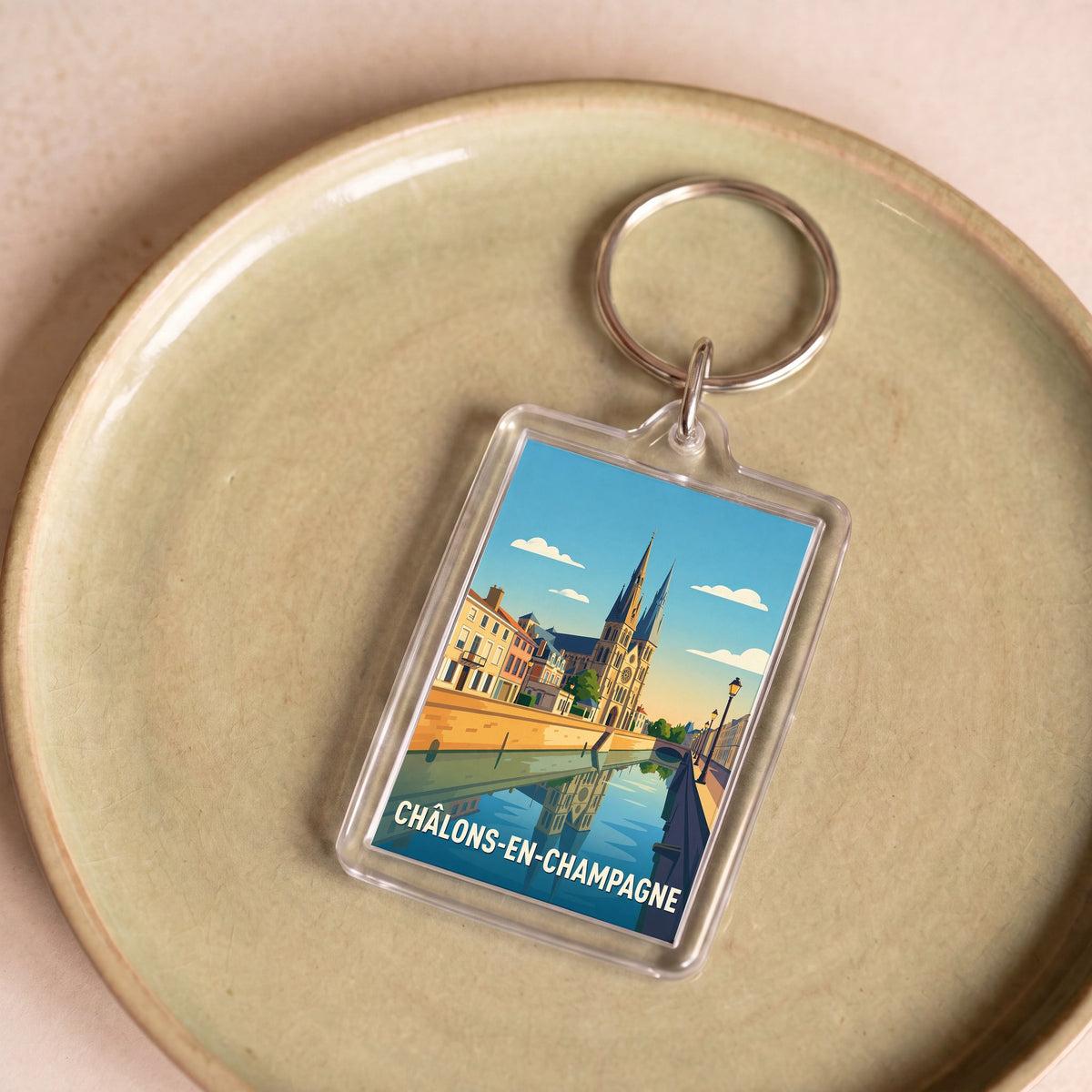 Porte-clés souvenir de la ville de Châlons-en-Champagne avec une illustration stylisée.