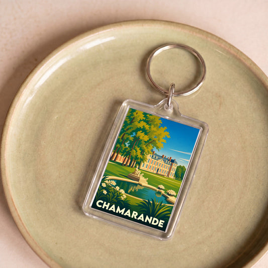 Porte-clés souvenir de la ville de Chamarande avec une illustration stylisée de son château et de son parc.