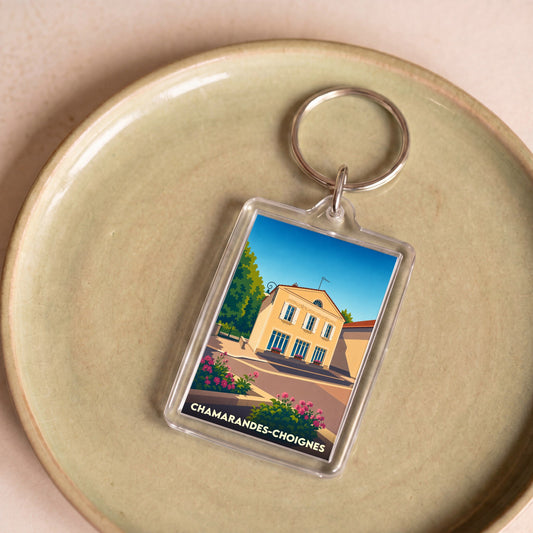Porte-clés souvenir de Chamarandes-Choignes avec une illustration stylisée de la ville.