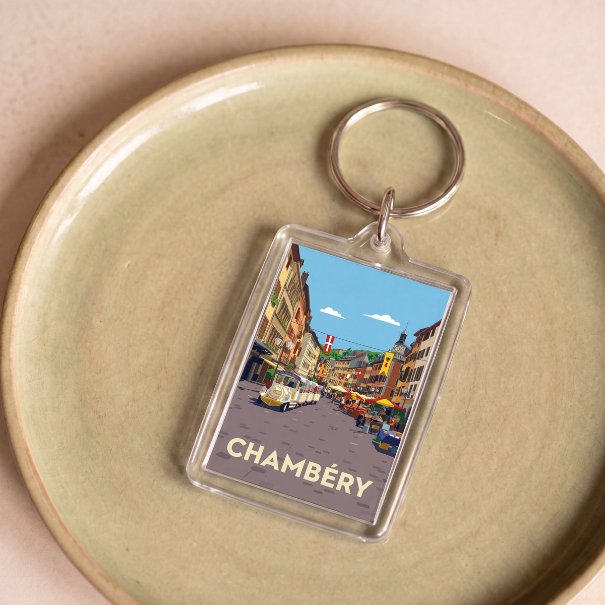 Porte-clés souvenir de la ville de Chambéry avec une illustration stylisée et colorée.