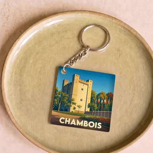 Porte-clés souvenir de la ville de Chambois avec une illustration stylisée d'un donjon médiéval.