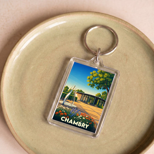 Porte-clés souvenir de la ville de Chambry avec une illustration stylisée et colorée.