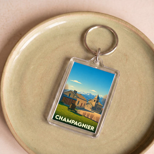 Porte-clés souvenir de la ville de Champagnier avec une illustration stylisée.