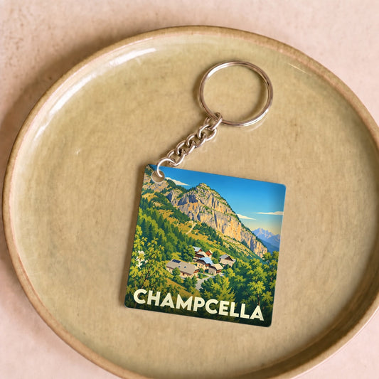 Porte-clés souvenir de la ville de Champcella avec une illustration stylisée de montagne.