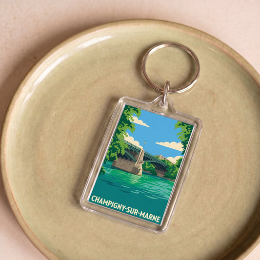 Porte-clés souvenir de la ville de Champigny-sur-Marne avec une illustration stylisée.