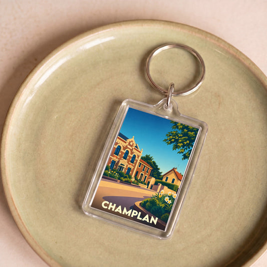 Porte-clés souvenir de la ville de Champlan avec une illustration stylisée.
