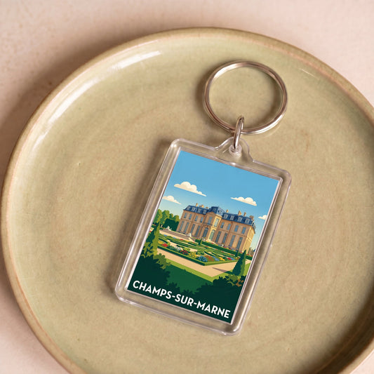 Porte-clés souvenir de la ville de Champs-sur-Marne avec une illustration stylisée de son château.