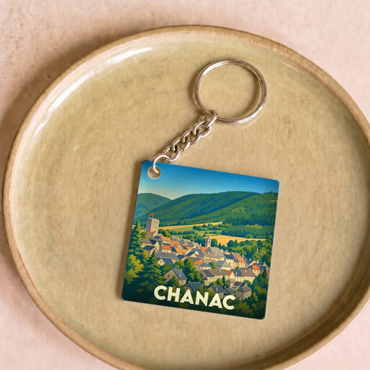 Porte-clés souvenir de la ville de Chanac avec une illustration stylisée.