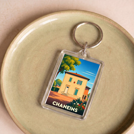 Porte-clés souvenir de la ville de Chaneins avec une illustration stylisée.