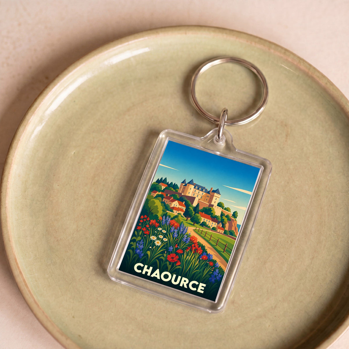 Porte-clés souvenir de la ville de Chaource avec une illustration stylisée et colorée.