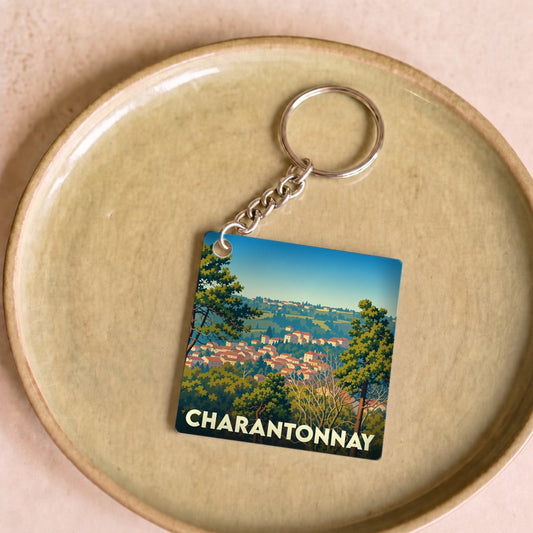 Porte-clés souvenir de la ville de Charantonnay avec une illustration stylisée.