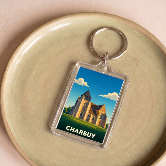 Porte-clés souvenir de la ville de Charbuy avec une illustration stylisée d'une église.