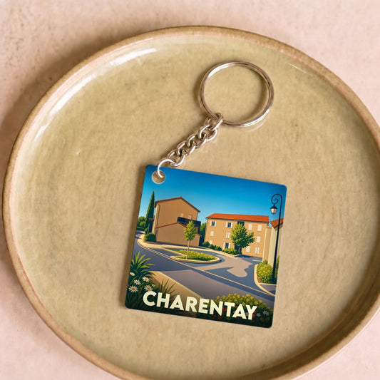 Porte-clés souvenir de la ville de Charentay avec une illustration stylisée d'un paysage urbain.