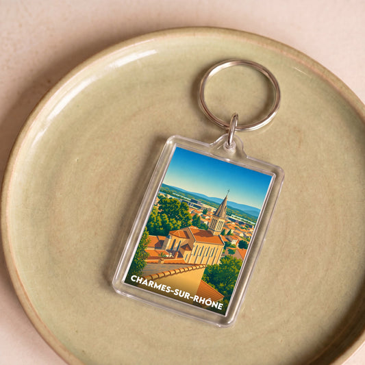 Porte-clés souvenir de la ville de Charmes-sur-Rhône avec une illustration stylisée.