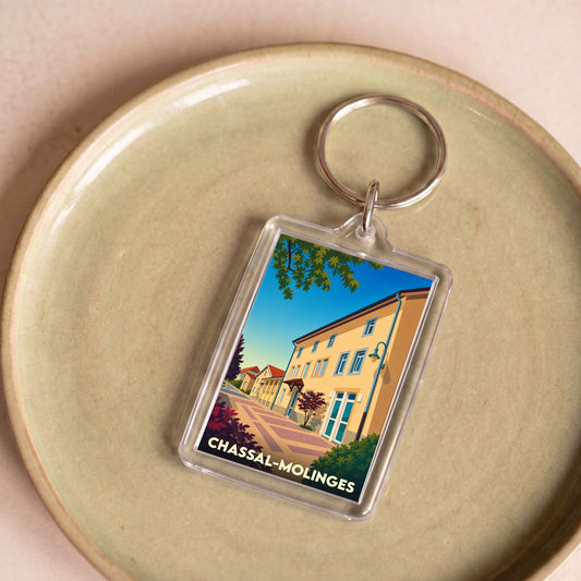 Porte-clés souvenir de la ville de Chassal-Molinges avec une illustration stylisée.