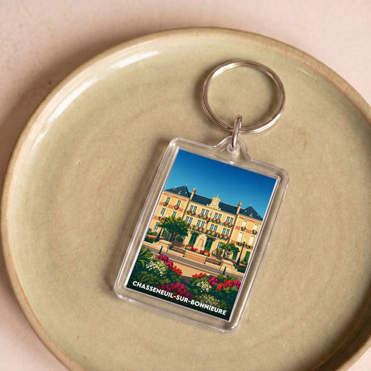 Porte-clés souvenir de la ville de Chasseneuil-sur-Bonnieure avec une illustration stylisée.