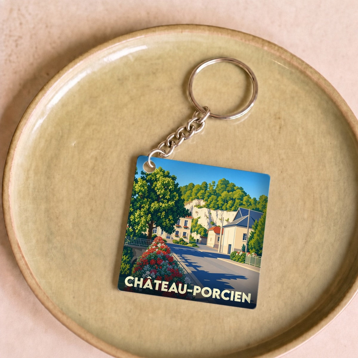 Porte-clés souvenir de la ville de Château-Porcien avec une illustration stylisée.