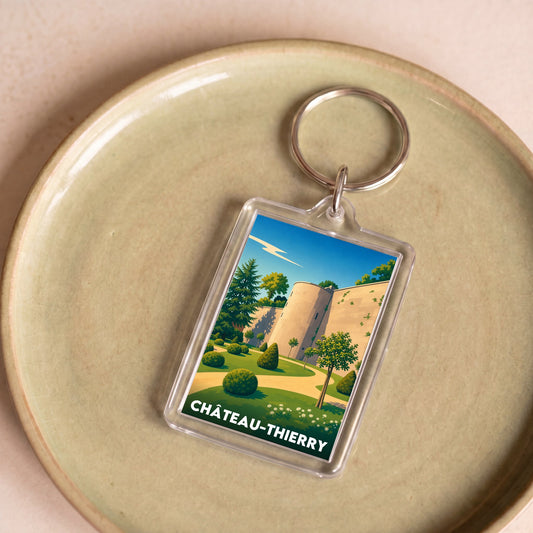 Porte-clés souvenir de la ville de Château-Thierry avec une illustration stylisée.