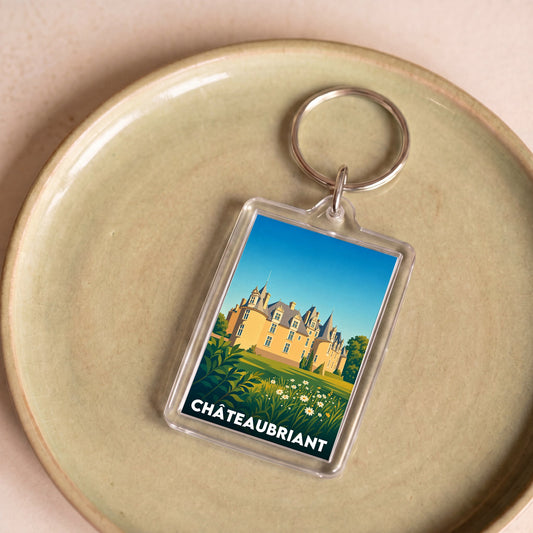Porte-clés souvenir de la ville de Châteaubriant avec une illustration stylisée.