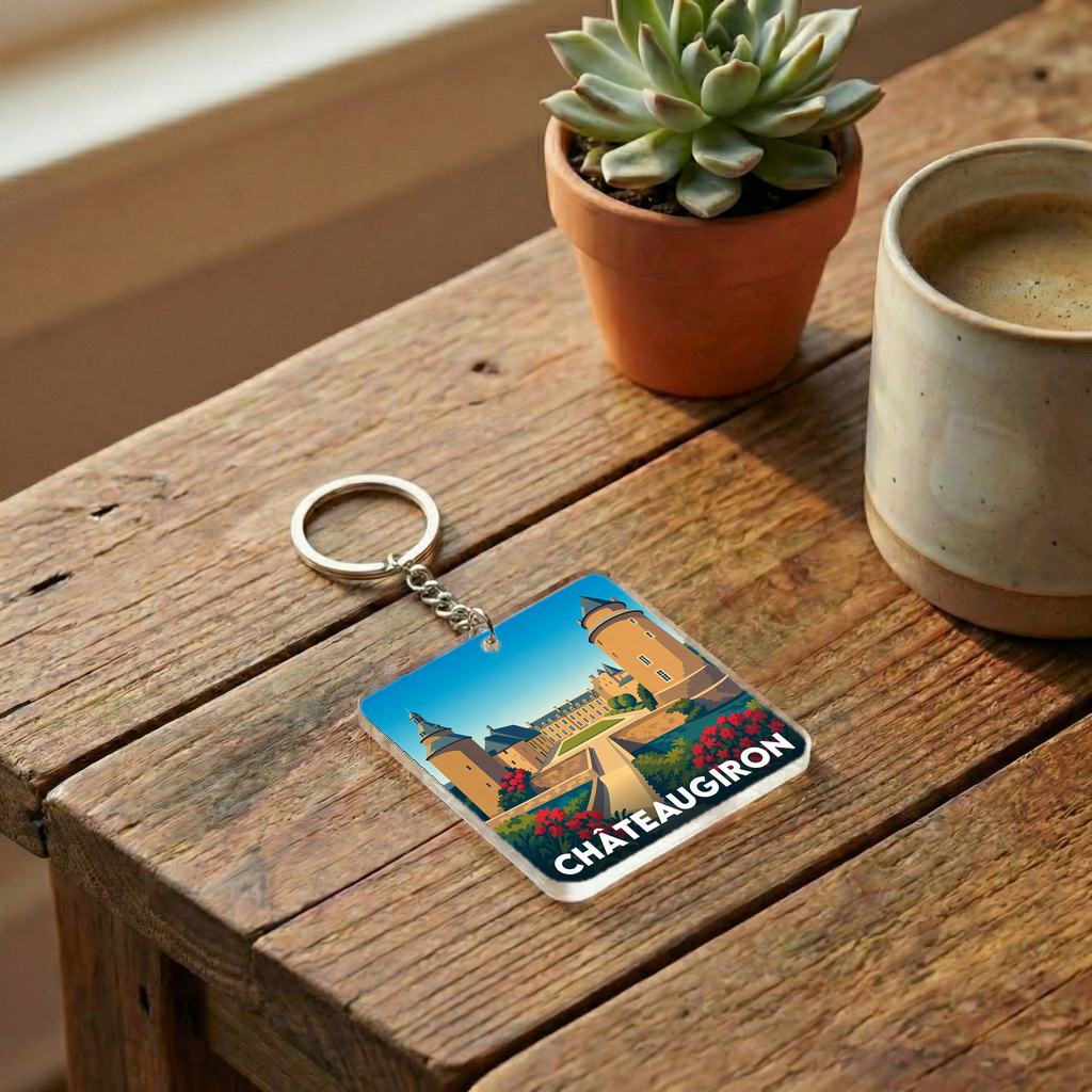 Porte-clés souvenir de la ville de Châteaugiron avec une illustration stylisée du château.
