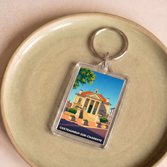 Porte-clés souvenir de la ville de Châteauneuf-sur-Charente avec une illustration stylisée.