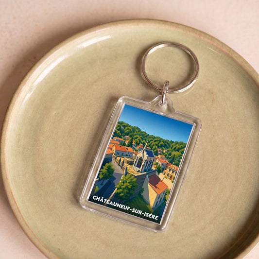 Porte-clés souvenir de la ville de Châteauneuf-sur-Isère avec une illustration stylisée.