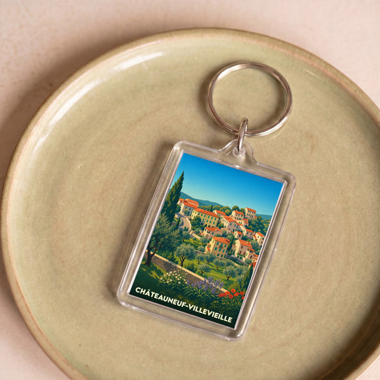 Porte-clés souvenir de la ville de Châteauneuf-Villevieille avec une illustration stylisée.
