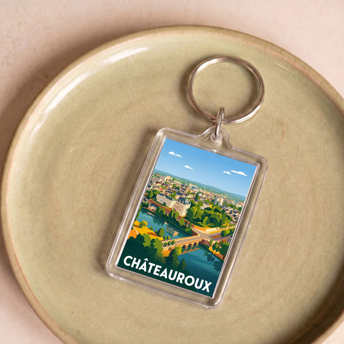 Porte-clés souvenir de la ville de Châteauroux avec une illustration stylisée.
