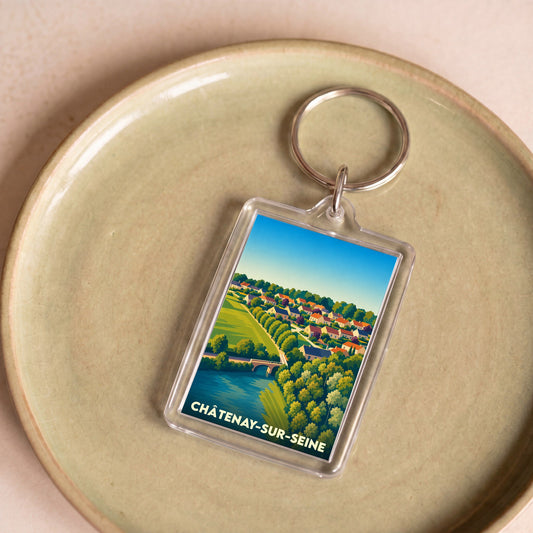 Porte-clés souvenir de la ville de Châtenay-sur-Seine avec une illustration stylisée.