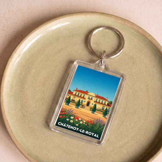 Porte-clés souvenir de la ville de Châtenoy-le-Royal avec une illustration stylisée.