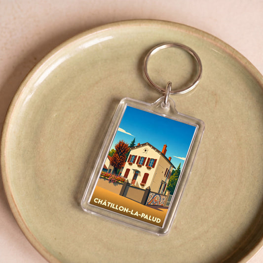 Porte-clés souvenir de la ville de Châtillon-la-Palud avec une illustration stylisée d'une maison traditionnelle.