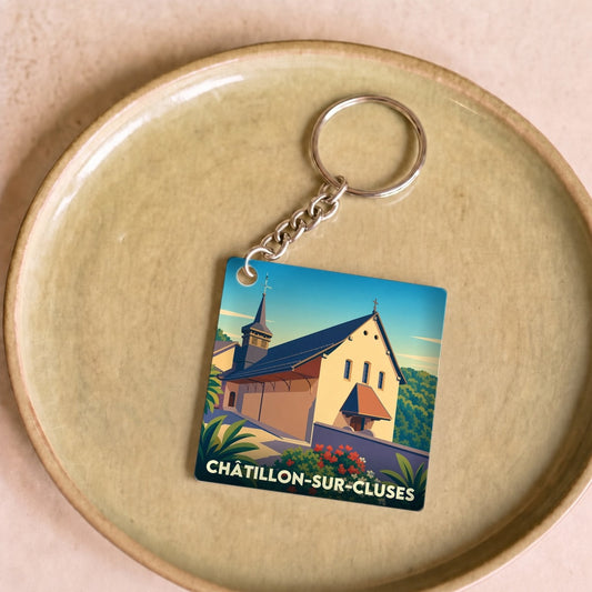 Porte-clés souvenir de Châtillon-sur-Cluses illustrant l'église du village dans un style graphique épuré.