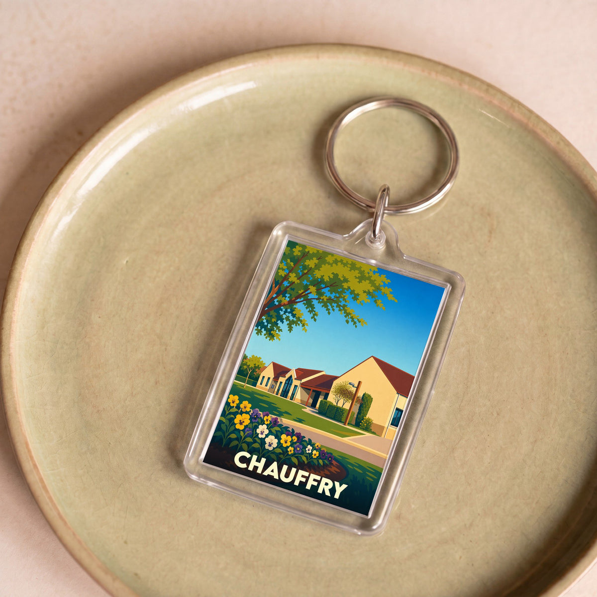 Porte-clés souvenir de la ville de Chauffry avec une illustration stylisée.