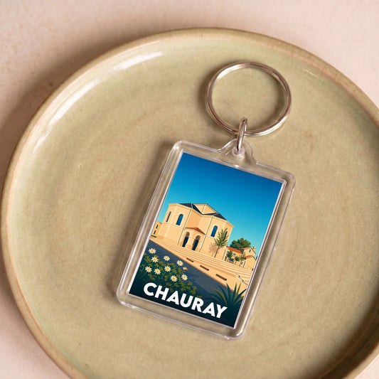 Porte-clés souvenir de la ville de Chauray avec une illustration stylisée d'un monument local.