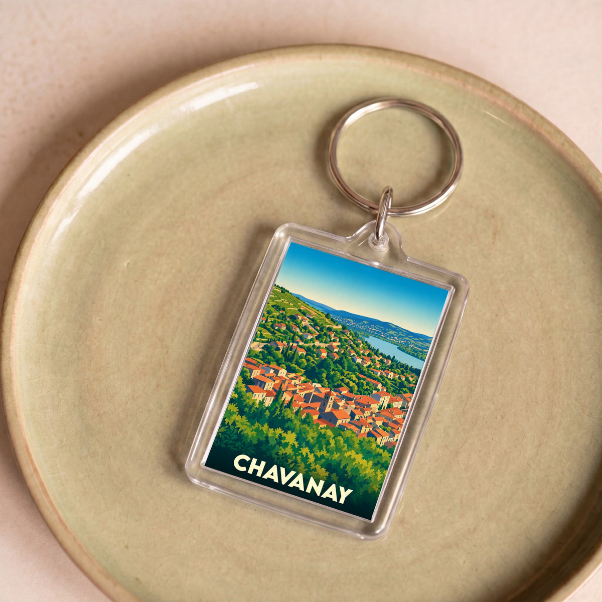 Porte-clés souvenir de la ville de Chavanay avec une illustration stylisée de ses toits et du Rhône.