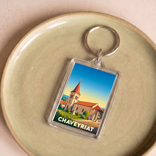 Porte-clés souvenir de la ville de Chaveyriat avec une illustration stylisée de son église.